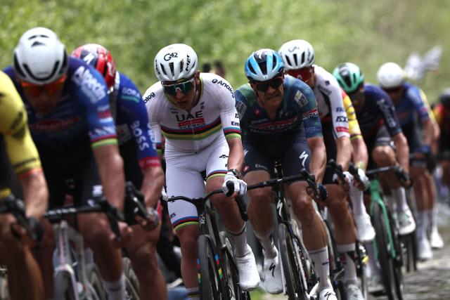 UAE Team Emirates XRG's Slovenian rider Tadej Pogacar (C) cycles on the 'Trouйe d’Arenberg' cobblestone sector (Arenberg trench) during the 123rd edition of the Paris-Roubaix one-day classic cycling race, 258.3 km between Compiиgne and Roubaix, northern France, on April 12, 2026. (Photo by Anne-Christine POUJOULAT / AFP)