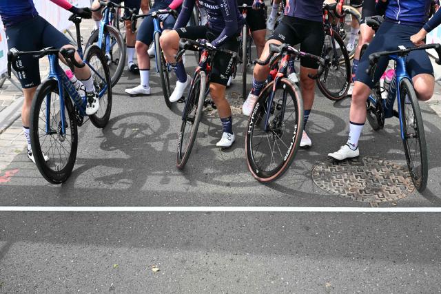 Riders wait at the start of the 6th edition of the Women Paris-Roubaix one-day classic cycling race, 143.1 km between Denain and Roubaix, northern France, on April 12, 2026. (Photo by NICOLAS TUCAT / AFP)