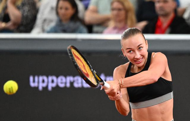 Austria's Anastasia Potapova returns the ball to Mirra Andreeva (not pictured) during their women's single final match of the WTA Upper Austria Women's Linz tennis tournament in Linz, Austria on April 12, 2026. (Photo by BARBARA GINDL / APA / AFP) / Austria OUT