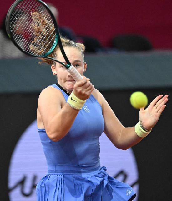 Mirra Andreeva returns the ball to Austria's Anastasia Potapova (not pictured) during their women's single final match of the WTA Upper Austria Women's Linz tennis tournament in Linz, Austria on April 12, 2026. (Photo by BARBARA GINDL / APA / AFP) / Austria OUT