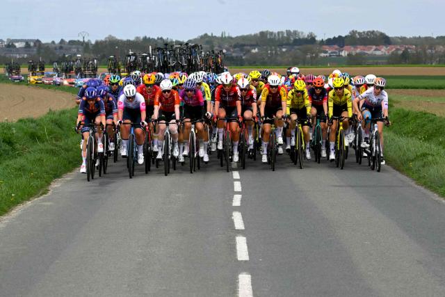 The pack rides during the 6th edition of the Women Paris-Roubaix one-day classic cycling race, 143.1 km between Denain and Roubaix, northern France, on April 12, 2026. (Photo by NICOLAS TUCAT / AFP)