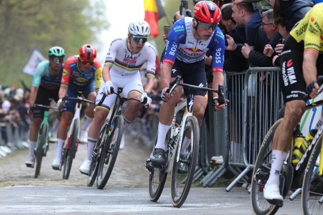 Red Bull - Bora - Hansgrohe's New Zealand rider Laurence Pithie (R), folowed by UAE Team Emirates XRG's Slovenian rider Tadej Pogacar leave the 'Trouйe d’Arenberg' cobblestone sector (Arenberg trench) during the 123rd edition of the Paris-Roubaix one-day classic cycling race, 258.3 km between Compiиgne and Roubaix, northern France, on April 12, 2026. (Photo by Francois LO PRESTI / AFP)