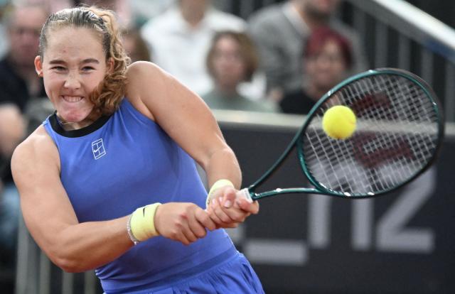 Mirra Andreeva returns the ball to Austria's Anastasia Potapova (not pictured) during their women's single final match of the WTA Upper Austria Women's Linz tennis tournament in Linz, Austria on April 12, 2026. (Photo by BARBARA GINDL / APA / AFP) / Austria OUT
