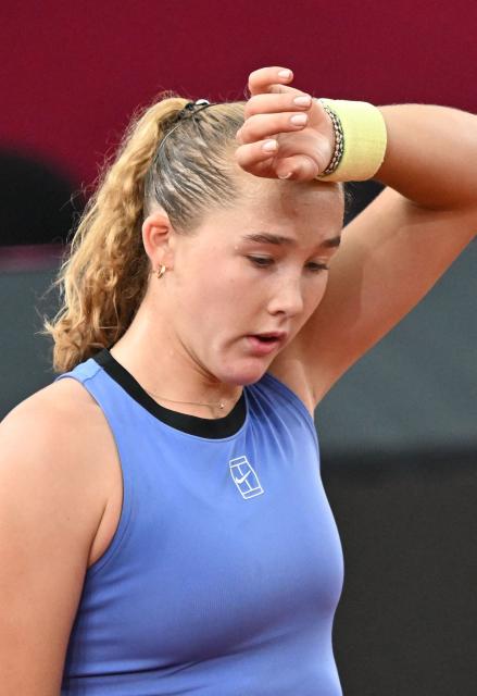 Mirra Andreeva reacts as she plays against Austria's Anastasia Potapova (not pictured) during their women's single final match of the WTA Upper Austria Women's Linz tennis tournament in Linz, Austria on April 12, 2026. (Photo by BARBARA GINDL / APA / AFP) / Austria OUT