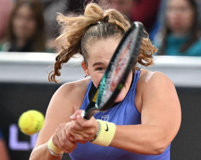 Mirra Andreeva returns the ball to Austria's Anastasia Potapova (not pictured) during their women's single final match of the WTA Upper Austria Women's Linz tennis tournament in Linz, Austria on April 12, 2026. (Photo by BARBARA GINDL / APA / AFP) / Austria OUT