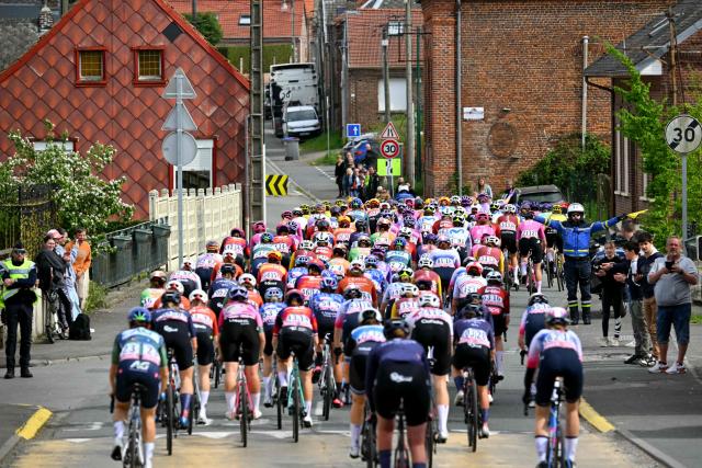 The pack of riders cycles during the 6th edition of the Women Paris-Roubaix one-day classic cycling race, 143.1 km between Denain and Roubaix, northern France, on April 12, 2026. (Photo by NICOLAS TUCAT / AFP)