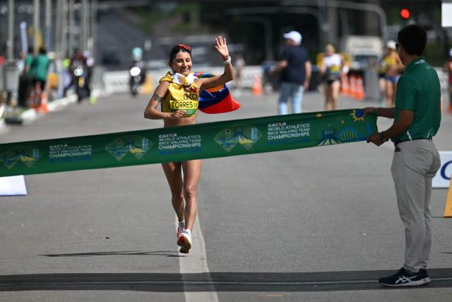 Ecuador's Paula Torres crosses the finish line to win the World Athletics Race Walking Team Championships women's marathon, in Brasilia, on April 12, 2026. (Photo by Evaristo SA / AFP)