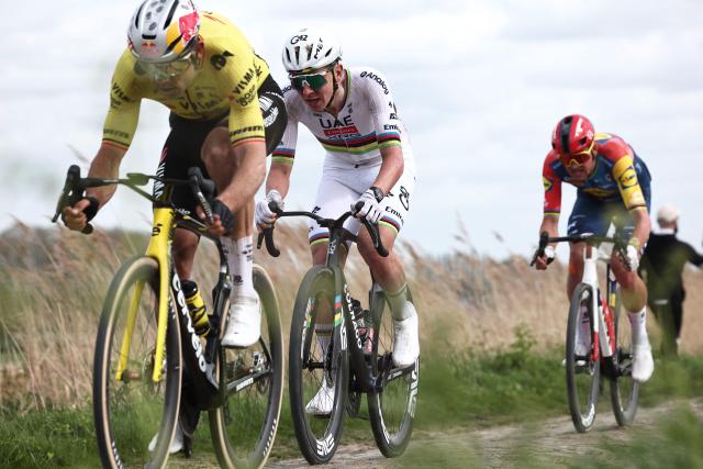 UAE Team Emirates XRG's Slovenian rider Tadej Pogacar (C) cycles on a cobblestone sector during the 123rd edition of the Paris-Roubaix one-day classic cycling race, 258.3 km between Compiègne and Roubaix, northern France, on April 12, 2026. (Photo by Anne-Christine POUJOULAT / AFP)