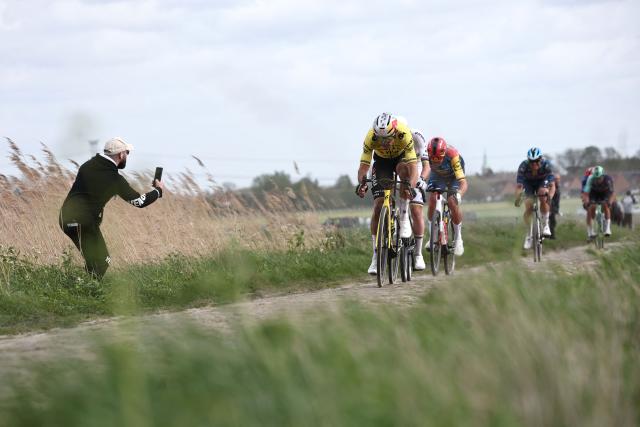 Team Visma - Lease a Bike's Belgian rider Wout van Aert leads in a cycles in a breakaway  during the 123rd edition of the Paris-Roubaix one-day classic cycling race, 258.3 km between Compiègne and Roubaix, northern France, on April 12, 2026. (Photo by Anne-Christine POUJOULAT / AFP)