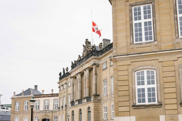 The flags on the Amalienborg palace wave at half-mast on April 12, 2026, in Copernhagen, Denmark, after the announcement of Queen Mary's father's death. John Donaldson passed away on April 11, 2026 in the city of Hobart on Mary Dondaldson's birth island, Tasmania. (Photo by Emil Nicolai Helms / Ritzau Scanpix / AFP) / Denmark OUT