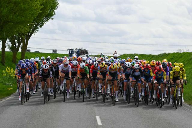 The pack of riders cycles during the 6th edition of the Women Paris-Roubaix one-day classic cycling race, 143.1 km between Denain and Roubaix, northern France, on April 12, 2026. (Photo by NICOLAS TUCAT / AFP)