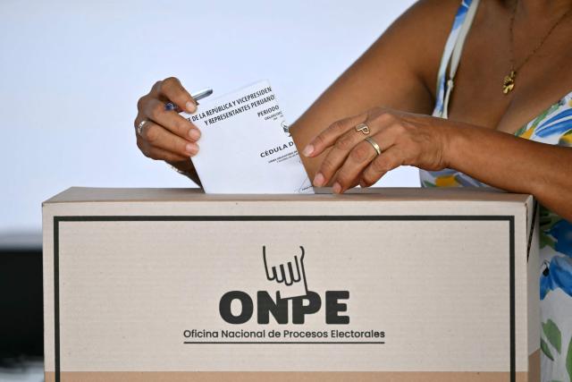 A woman casts her ballot during the presidential election at a polling station in Lima on April 12, 2026. Peruvians will elect a new president from a record field of 35 candidates to lead a country plagued by organized crime and chronic political instability. (Photo by Luis ROBAYO / AFP)