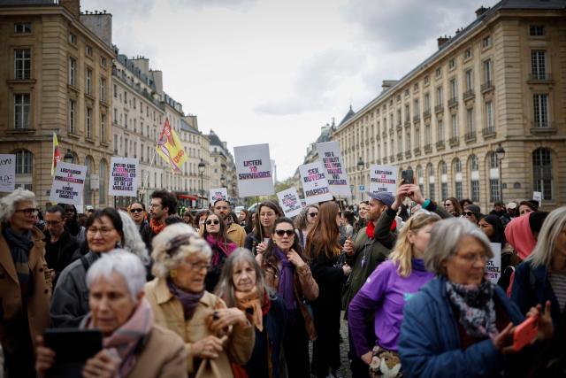 Protesters take part in a demonstration organised by the Collectif Abolition, a network of associations and activists aiming to end prostitution, on the occasion of the tenth anniversary of the prostitution law in France, in Paris on April 12, 2026. The 2016 French law made buying sex illegal, decriminalised sex workers, and created support programs to help them exit prostitution. (Photo by Ian LANGSDON / AFP)