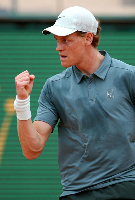 Italy's Jannik Sinner reacts after a point against Spain's Carlos Alcaraz during the Monte Carlo ATP Masters Series Tournament final tennis match on Court Rainier III at the Monte-Carlo Country Club in Roquebrune-Cap-Martin, south-eastern France on April 12, 2026. (Photo by Valery HACHE / AFP)