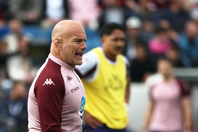 Bordeaux-Begles' French manager Yannick Bru leads the warm up prior to the  European Champions Cup rugby union quarter-final match between Union Bordeaux Belges (UBB) and Stade Toulousain (Toulouse) at the Chaban-Delmas Stadium in Bordeaux, southwestern France, on April 12, 2026. (Photo by ROMAIN PERROCHEAU / AFP)