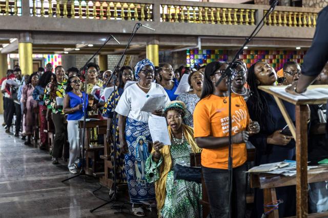 Members of a choir rehearse ahead of Pope Leo XIV’s visit at Saint Joseph Metropolitan Cathedral in Bamenda, on April 12, 2026. (Photo by PATRICK MEINHARDT / AFP)