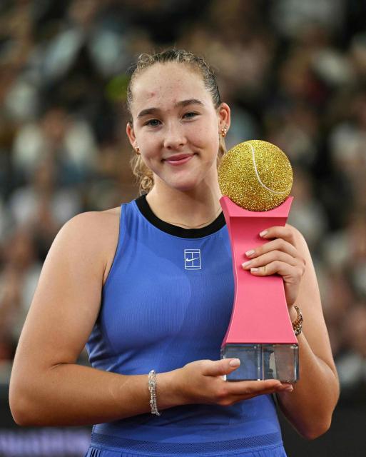 Russia's Mirra Andreeva poses with her golden trophy after winning the women's single final match of the WTA Upper Austria Women's Linz tennis tournament in Linz, Austria on April 12, 2026. (Photo by BARBARA GINDL / APA / AFP) / Austria OUT