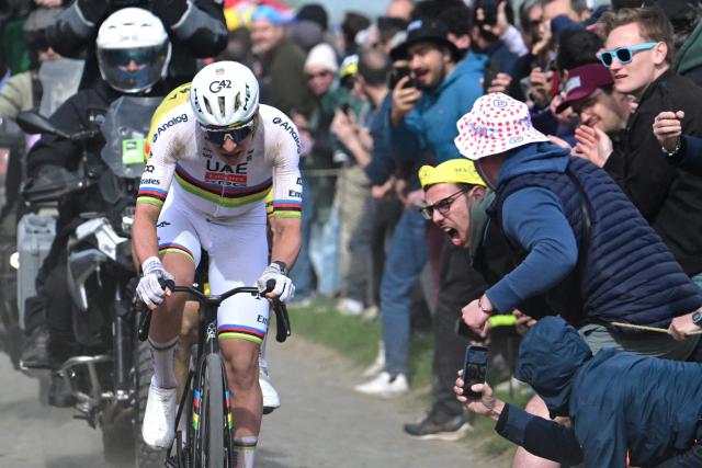 UAE Team Emirates XRG's Slovenian rider Tadej Pogacar cycles in a breakaway on a cobblestone sector during the 123rd edition of the Paris-Roubaix one-day classic cycling race, 258.3 km between Compiègne and Roubaix, northern France, on April 12, 2026. (Photo by Bernard PAPON / POOL / AFP)