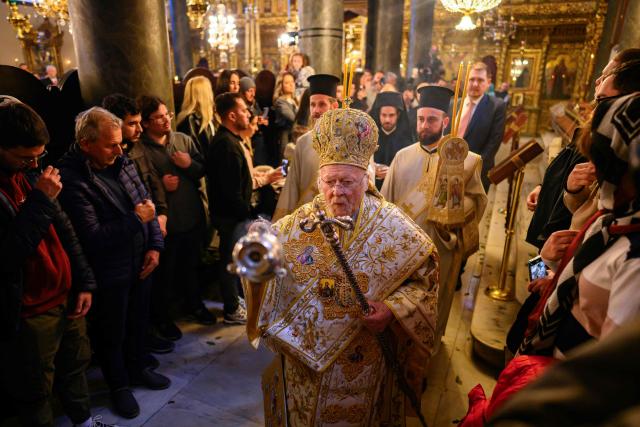 Ecumenical Patriarch Bartholomew I of Constantinople (C) leads the Orthodox Easter service at the Patriarchal Church of St. George, in Istanbul on April 12, 2026. (Photo by Yasin AKGUL / AFP)