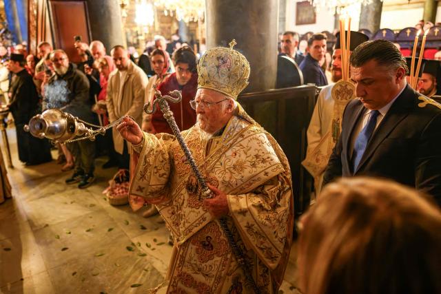 Ecumenical Patriarch Bartholomew I of Constantinople (C) leads the Orthodox Easter service at the Patriarchal Church of St. George, in Istanbul on April 12, 2026. (Photo by Yasin AKGUL / AFP)
