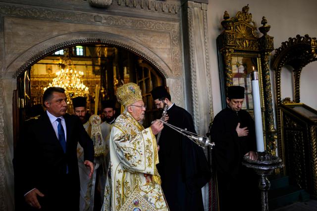 Ecumenical Patriarch Bartholomew I of Constantinople (C) leads the Orthodox Easter service at the Patriarchal Church of St. George, in Istanbul on April 12, 2026. (Photo by Yasin AKGUL / AFP)