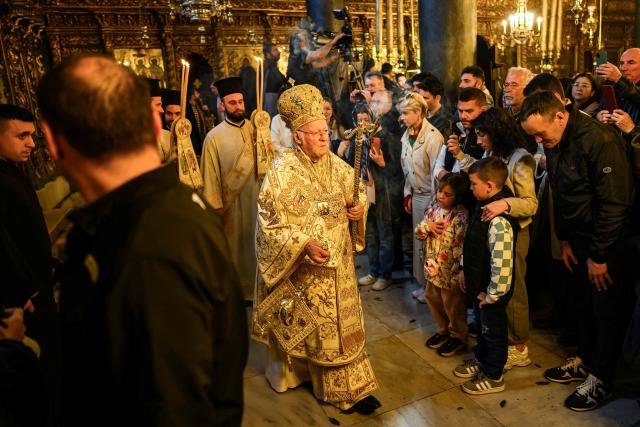 Ecumenical Patriarch Bartholomew I of Constantinople (C) leads the Orthodox Easter service at the Patriarchal Church of St. George, in Istanbul on April 12, 2026. (Photo by Yasin AKGUL / AFP)