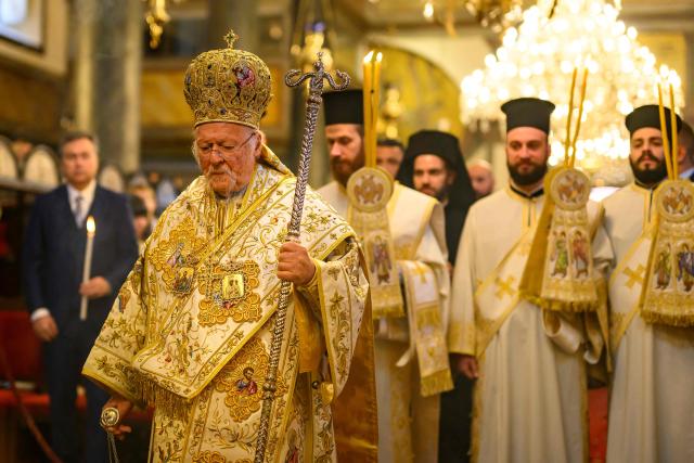 Ecumenical Patriarch Bartholomew I of Constantinople (L) leads the Orthodox Easter service at the Patriarchal Church of St. George, in Istanbul on April 12, 2026. (Photo by Yasin AKGUL / AFP)