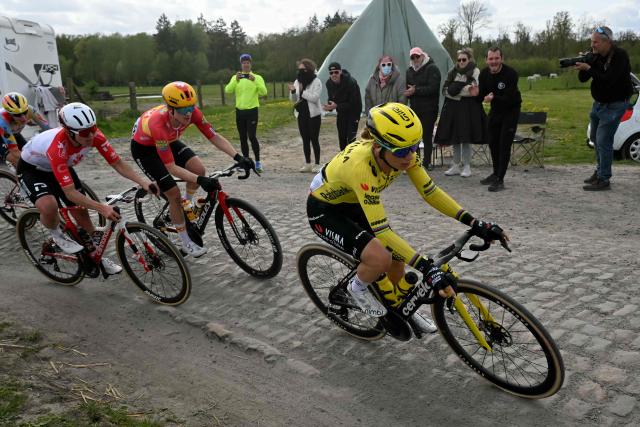 Team Visma - Lease a Bike's French rider Pauline Ferrand-Prévot (R) rides with the pack on a cobblestone sector during the 6th edition of the Women Paris-Roubaix one-day classic cycling race, 143.1 km between Denain and Roubaix, northern France, on April 12, 2026. (Photo by NICOLAS TUCAT / AFP)