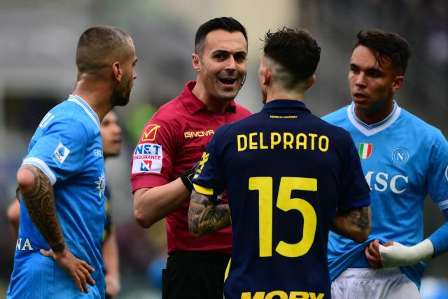 Italian referee Marco Di Bello argues with Parma’s Italian defender #15 Enrico Delprato during the Italian Serie A football match between Parma and Napoli at the Ennio Tardini stadium in Parma on April 12, 2026. (Photo by MARCO BERTORELLO / AFP)