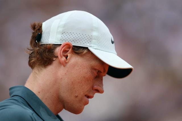 Italy's Jannik Sinner looks on as he plays against Spain's Carlos Alcaraz during the Monte Carlo ATP Masters Series Tournament final tennis match on Court Rainier III at the Monte-Carlo Country Club in Roquebrune-Cap-Martin, south-eastern France on April 12, 2026. (Photo by Valery HACHE / AFP)