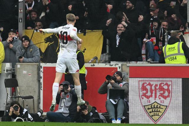 Stuttgart's German midfielder #10 Chris Fuehrich celebrates scoring the 2-0 goal during the German first division Bundesliga football match between VfB Stuttgart and Hamburger SV in Stuttgart, southwestern Germany on April 12, 2026. (Photo by THOMAS KIENZLE / AFP) / DFL REGULATIONS PROHIBIT ANY USE OF PHOTOGRAPHS AS IMAGE SEQUENCES AND/OR QUASI-VIDEO