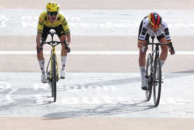 FDJ United-SUEZ's German rider Franziska Koch (R) crosses the finish line ahead of Team Visma - Lease a Bike's Dutch rider Marianne Vos to win the 6th edition of the Women Paris-Roubaix one-day classic cycling race, 143.1 km between Denain and Roubaix, at the Vélodrome André-Pétrieux in Roubaix, northern France, on April 12, 2026. (Photo by Francois LO PRESTI / AFP)