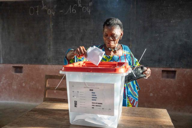 A voter casts her ballot at a polling station set up in a primary school in Lokossa on April 12, 2026 during Benin's presidential elections. (Photo by Yanick Folly / AFP)