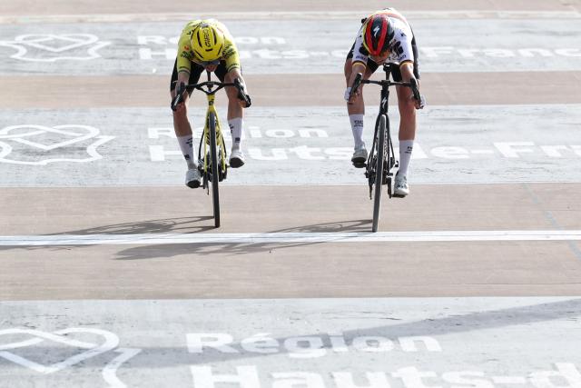 FDJ United-SUEZ's German rider Franziska Koch (R) crosses the finish line ahead of Team Visma - Lease a Bike's Dutch rider Marianne Vos to win the 6th edition of the Women Paris-Roubaix one-day classic cycling race, 143.1 km between Denain and Roubaix, at the Vélodrome André-Pétrieux in Roubaix, northern France, on April 12, 2026. (Photo by Francois LO PRESTI / AFP)