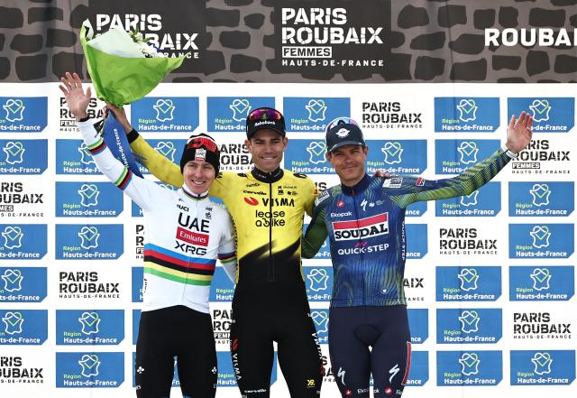 (From L) Second-placed UAE Team Emirates XRG's Slovenian rider Tadej Pogacar, winner Team Visma - Lease a Bike's Belgian rider Wout van Aert and third-placed Soudal Quick-Step's Belgian rider Jasper Stuyven celebrate on the podium of the 123rd edition of the Paris-Roubaix one-day classic cycling race, 258.3 km between Compiègne and Roubaix, at the Vélodrome André-Pétrieux in Roubaix, northern France, on April 12, 2026. (Photo by Anne-Christine POUJOULAT / AFP)