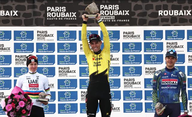 (From L) Second-placed UAE Team Emirates XRG's Slovenian rider Tadej Pogacar, winner Team Visma - Lease a Bike's Belgian rider Wout van Aert and third-placed Soudal Quick-Step's Belgian rider Jasper Stuyven celebrate on the podium of the 123rd edition of the Paris-Roubaix one-day classic cycling race, 258.3 km between Compiègne and Roubaix, at the Vélodrome André-Pétrieux in Roubaix, northern France, on April 12, 2026. (Photo by Anne-Christine POUJOULAT / AFP)