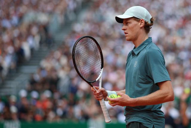 Italy's Jannik Sinner looks on as he plays against Spain's Carlos Alcaraz during the Monte Carlo ATP Masters Series Tournament final tennis match on Court Rainier III at the Monte-Carlo Country Club in Roquebrune-Cap-Martin, south-eastern France on April 12, 2026. (Photo by Valery HACHE / AFP)
