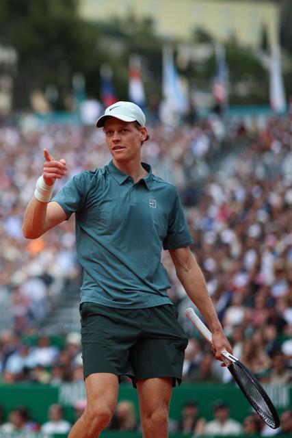 Italy's Jannik Sinner looks on as he plays against Spain's Carlos Alcaraz during the Monte Carlo ATP Masters Series Tournament final tennis match on Court Rainier III at the Monte-Carlo Country Club in Roquebrune-Cap-Martin, south-eastern France on April 12, 2026. (Photo by Valery HACHE / AFP)