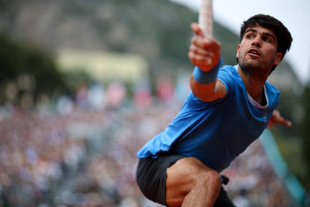 Spain's Carlos Alcaraz looks on as he plays against Italy's Jannik Sinner during the Monte Carlo ATP Masters Series Tournament final tennis match on Court Rainier III at the Monte-Carlo Country Club in Roquebrune-Cap-Martin, south-eastern France on April 12, 2026. (Photo by Valery HACHE / AFP)