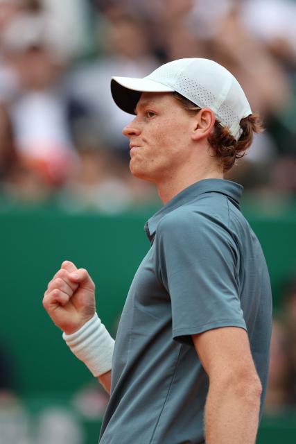 Italy's Jannik Sinner reacts as he plays against Spain's Carlos Alcaraz during the Monte Carlo ATP Masters Series Tournament final tennis match on Court Rainier III at the Monte-Carlo Country Club in Roquebrune-Cap-Martin, south-eastern France on April 12, 2026. (Photo by Valery HACHE / AFP)