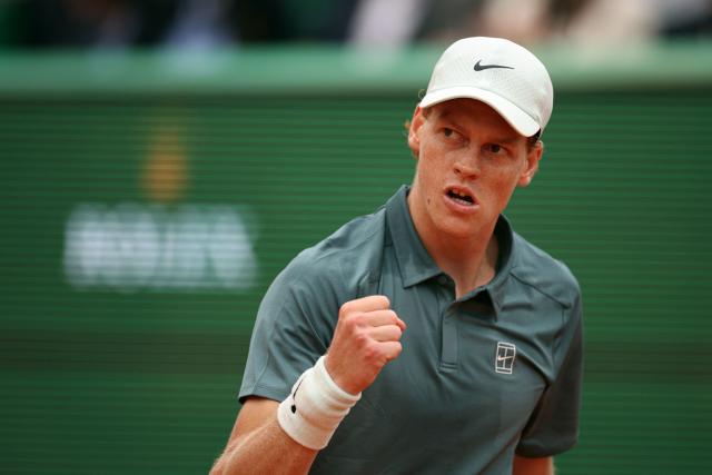 Italy's Jannik Sinner reacts as he plays against Spain's Carlos Alcaraz during the Monte Carlo ATP Masters Series Tournament final tennis match on Court Rainier III at the Monte-Carlo Country Club in Roquebrune-Cap-Martin, south-eastern France on April 12, 2026. (Photo by Valery HACHE / AFP)
