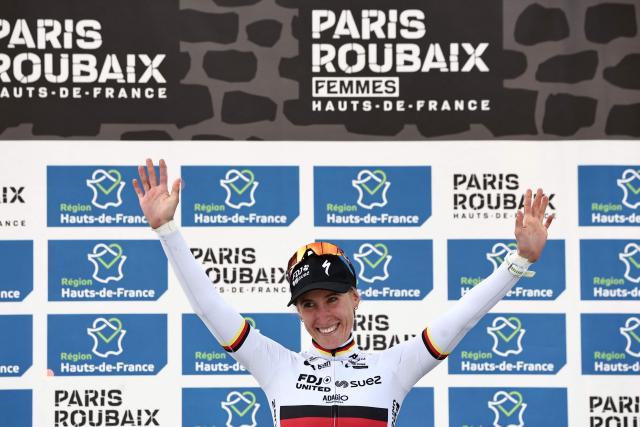 Winner FDJ United-SUEZ's German rider Franziska Koch celebrates on the podium of the 6th edition of the Women Paris-Roubaix one-day classic cycling race, 143.1 km between Denain and Roubaix, at the Vélodrome André-Pétrieux in Roubaix, northern France, on April 12, 2026. (Photo by Anne-Christine POUJOULAT / AFP)