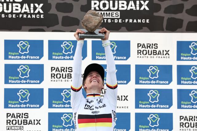 Winner FDJ United-SUEZ's German rider Franziska Koch celebrates on the podium of the 6th edition of the Women Paris-Roubaix one-day classic cycling race, 143.1 km between Denain and Roubaix, at the Vélodrome André-Pétrieux in Roubaix, northern France, on April 12, 2026. (Photo by Anne-Christine POUJOULAT / AFP)