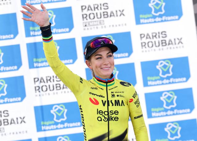 Team Visma - Lease a Bike's French rider Pauline Ferrand-Prévot celebrates on the podium of the 6th edition of the Women Paris-Roubaix one-day classic cycling race, 143.1 km between Denain and Roubaix, at the Vélodrome André-Pétrieux in Roubaix, northern France, on April 12, 2026. (Photo by Francois LO PRESTI / AFP)