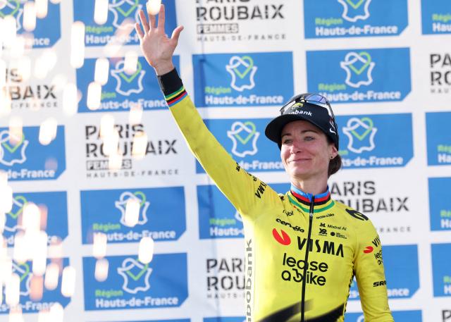 Second-placed Team Visma - Lease a Bike's Dutch rider Marianne Vos celebrates on the podium of the 6th edition of the Women Paris-Roubaix one-day classic cycling race, 143.1 km between Denain and Roubaix, at the Vélodrome André-Pétrieux in Roubaix, northern France, on April 12, 2026. (Photo by Francois LO PRESTI / AFP)
