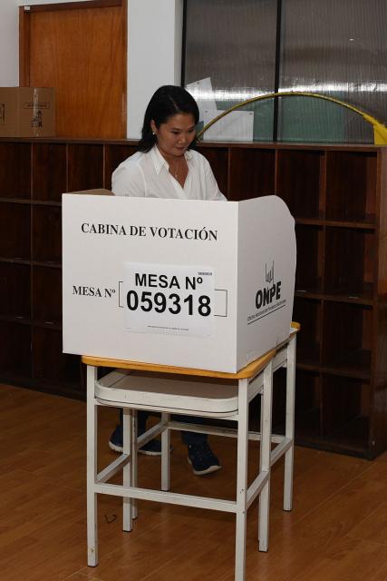Peru's presidential candidate for the Fuerza Popular party, Keiko Fujimori, votes in Lima on April 12, 2026, during the presidential election. Peruvians will elect a new president from a record field of 35 candidates to lead a country plagued by organized crime and chronic political instability. (Photo by AFP)