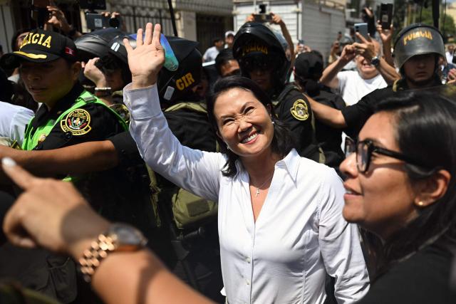 Peru's presidential candidate for the Fuerza Popular party, Keiko Fujimori, waves as she leaves after voting in Lima on April 12, 2026, during the presidential election. Peruvians will elect a new president from a record field of 35 candidates to lead a country plagued by organized crime and chronic political instability. (Photo by ERNESTO BENAVIDES / AFP)