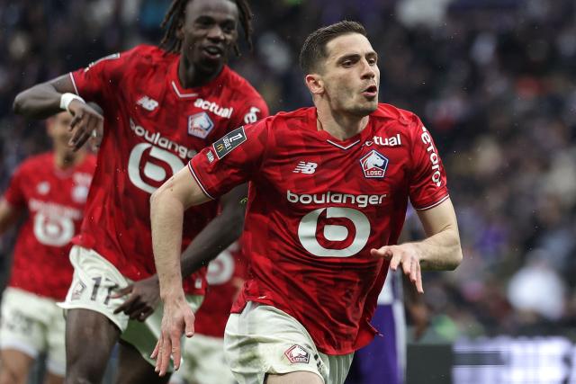 Lille's French defender #15 Romain Perraud celebrates after scoring during the French L1 football match between Toulouse FC and Lille LOSC at the TFC Stadium in Toulouse, southwestern France, on April 12, 2026. (Photo by Valentine CHAPUIS / AFP)