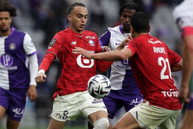 Lille's French midfielder #08 Ethan Mbappe (L) controls the ball during the French L1 football match between Toulouse FC and Lille LOSC at the Stadium de Toulouse in Toulouse, southwestern France, on April 12, 2026. (Photo by Valentine CHAPUIS / AFP)