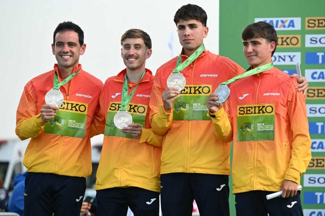 Spain's team members pose with their bronze medals during the award ceremony of the World Athletics Race Walking Team Championships men's team half-marathon, in Brasilia, on April 12, 2026. (Photo by Evaristo SA / AFP)
